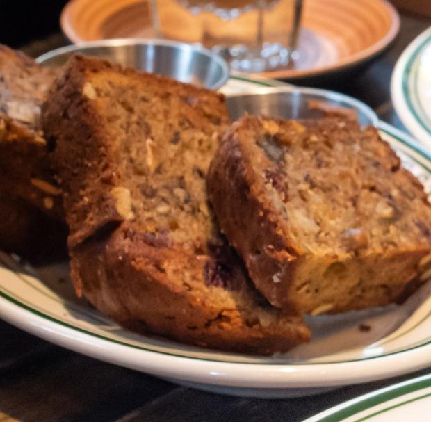 Grilled banana bread, sliced, walnuts through the crumb